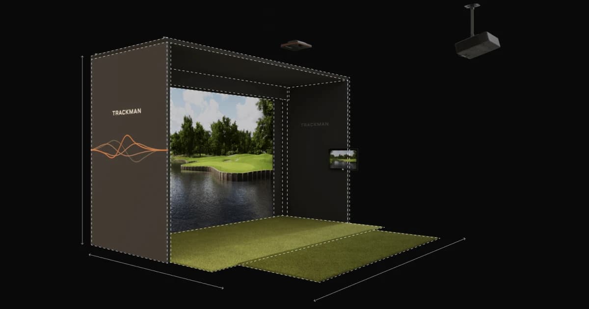 A golf simulator setup with a large screen displaying a golf course, surrounded by a mat and tracking equipment.