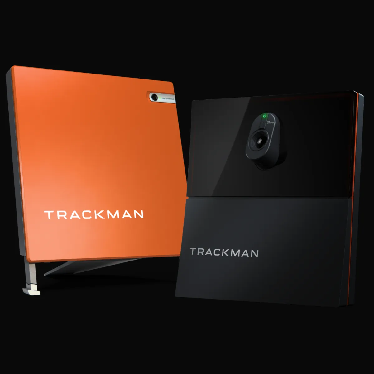 Two Trackman devices: one orange with a stand, one black with a camera lens, both against a black background.